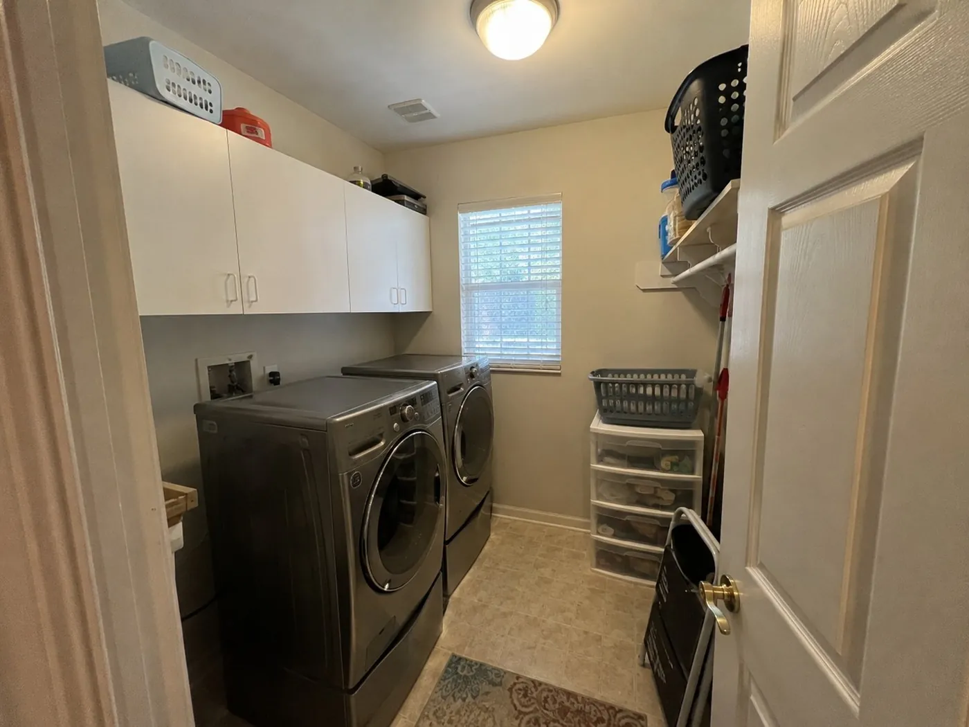Cluttered laundry room before the remodel